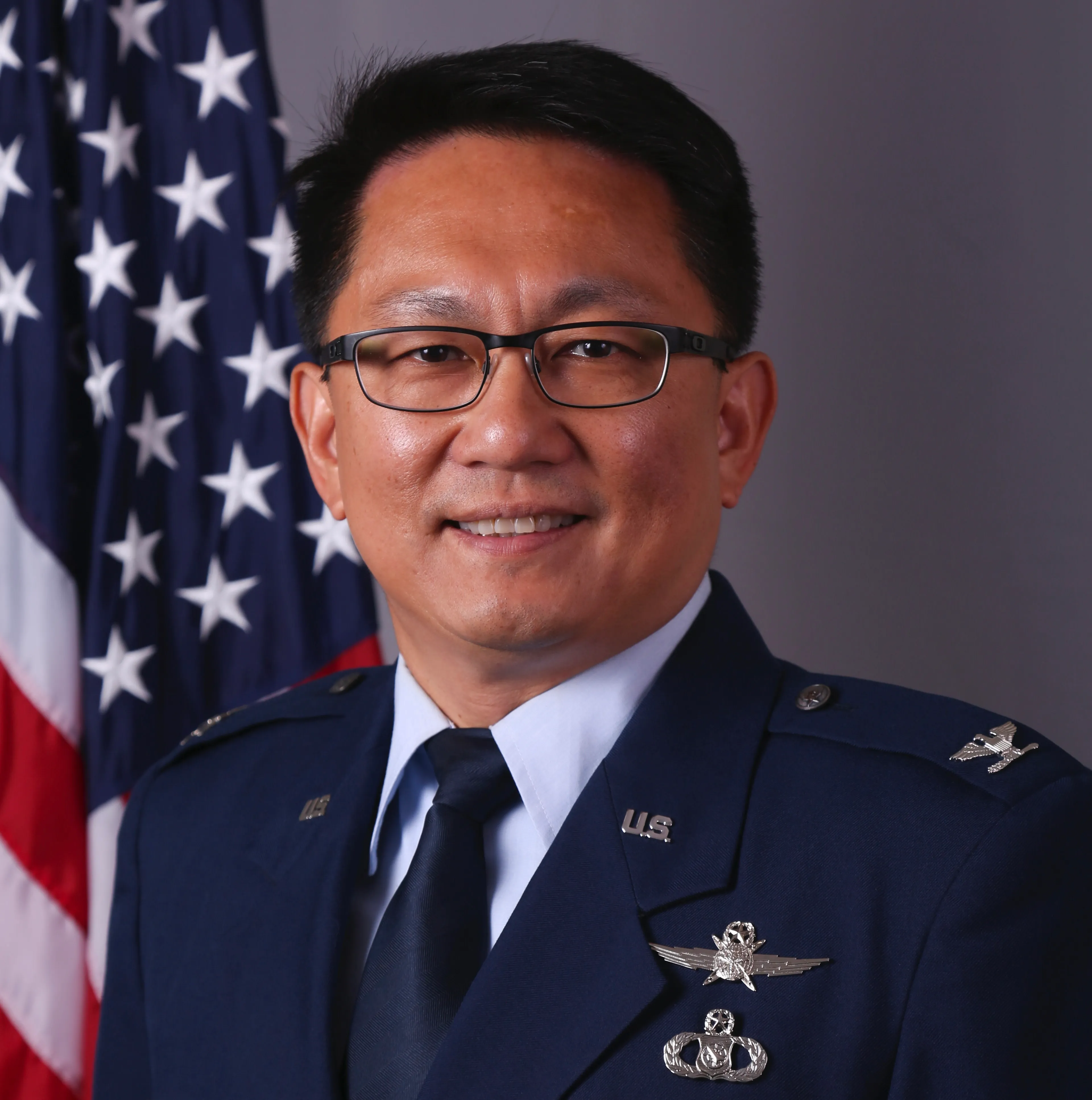 Colonel Pete, founder of the Tocqueville Liberty Institute, in U.S. Air Force dress uniform beside an American flag